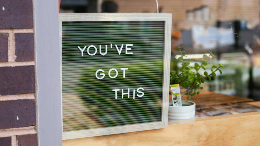"You've got this sign on the door of a coffee shop" as a helpful reminder for remote workers who want to stay motivated when working independently.
